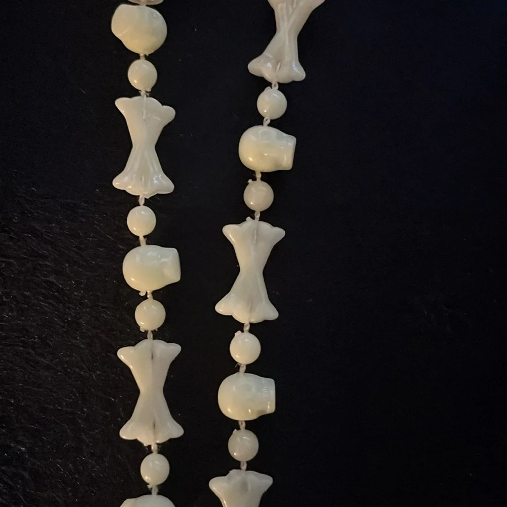 Halloween Spider and bones glow in the dark necklace.